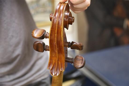 A cello and two bows, cello height 123cm